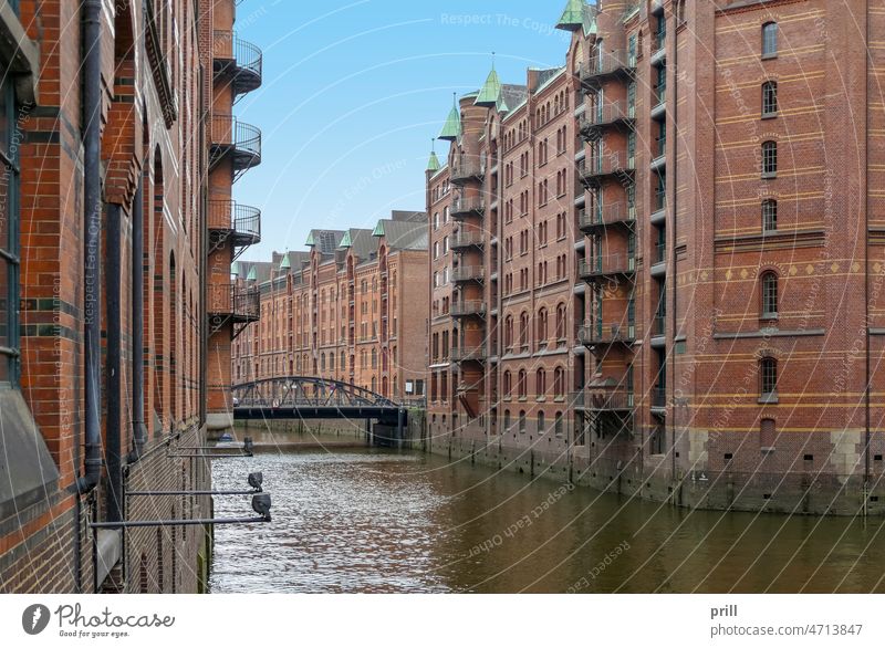 Speicherstadt in Hamburg storehouse city warehouse district Germany old historic Port City canal bridge facade House facade brick Brick wall port of hamburg