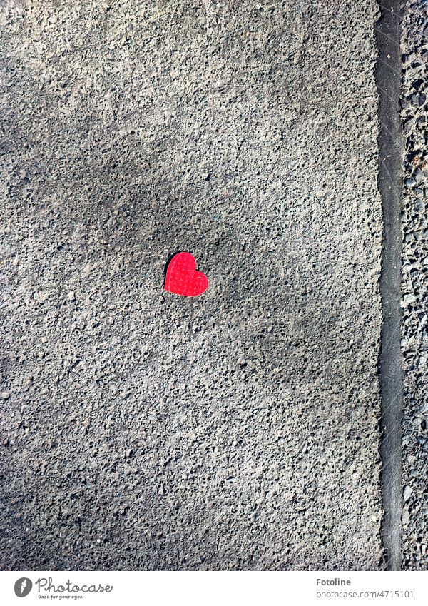 I just couldn't walk past this little red heart on the drab, gray asphalt. Heart Red Love Heart-shaped Paper Street Sign Close-up Declaration of love