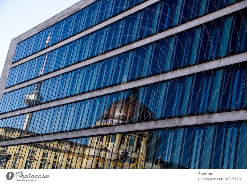 The TV tower in Berlin is reflected in the panes of glass on the facade of the new building. Facade Glass Window Window pane Architecture