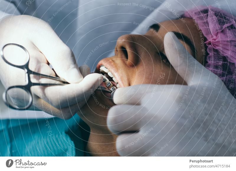 Young female patient takes a dental attendance in the dentist's office. care career cary tooth caucasian chair clinic concept make well clean smile hygiene