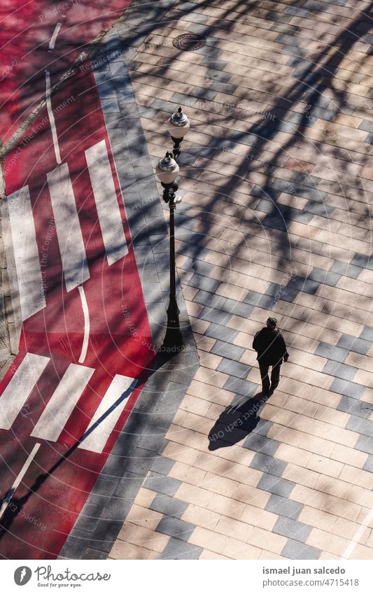 pedestrian walking on the street visiting Bilbao city, Spain tourist tourism person people human shadow silhouette ground outdoors urban city life lifestyle