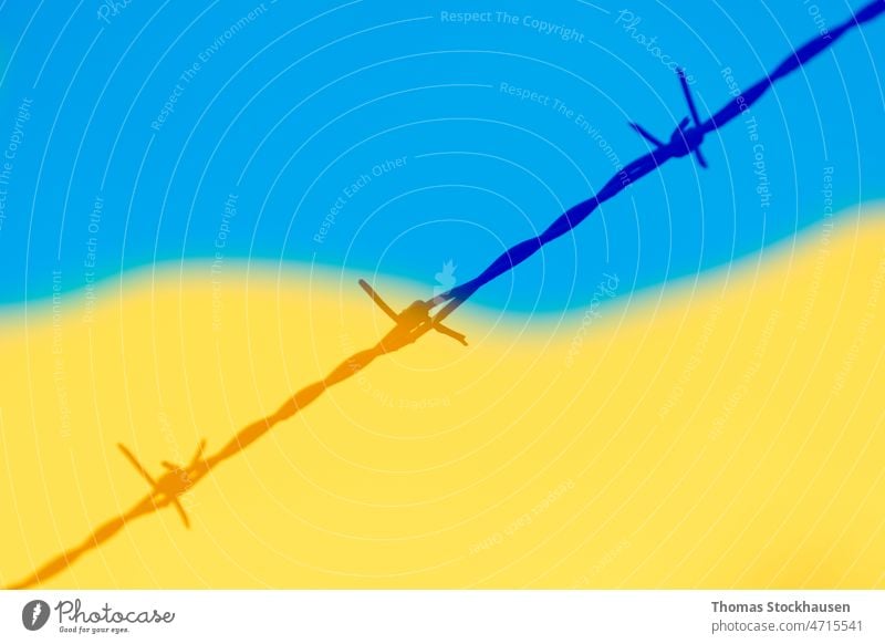 Barbed wire and colors of Ukrainian flag symbolizing refugees from Russian invasion of Ukraine background barbed Blue Border Boundary concept Copy Space peril