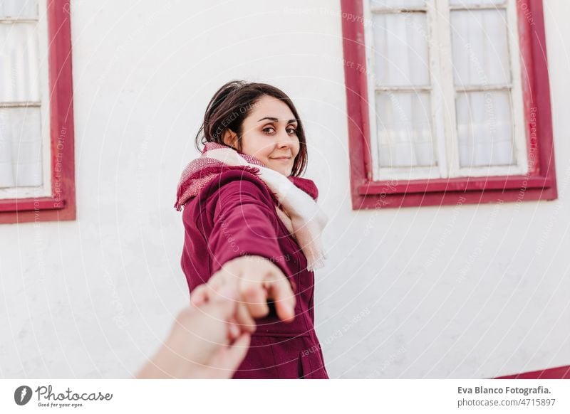 happy holding hand to camera.colorful houses.promenade Costa Nova, Aveiro. follow me woman travel city aveiro costa nova portugal tourist tourism urban blue