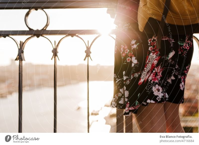 close up of unrecognizable woman in Porto bridge at sunset. Travel and lifestyle porto city travel tourist enjoy 30s relax holidays vacation urban high