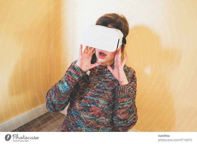 Spontaneous portrait of a young woman using cardboard vr glasses metaverse technology sustainability gamer virtual reality future progress concept surreal