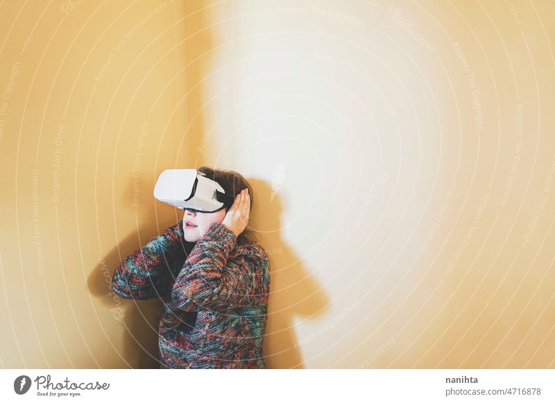 Spontaneous portrait of a young woman using cardboard vr glasses metaverse technology sustainability gamer virtual reality future progress concept surreal