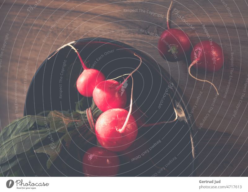 Fresh radishes in black bowl on wooden board Eating colour red food fruits Kitchen Nature Food Nutrition Healthy Vegetarian diet Organic produce Healthy Eating