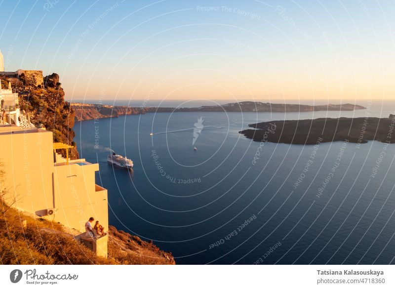 View of the bay of Santorini and the cruise ship during sunset aegean beautiful blue boat coast cyclades destination greece greek holiday island landscape