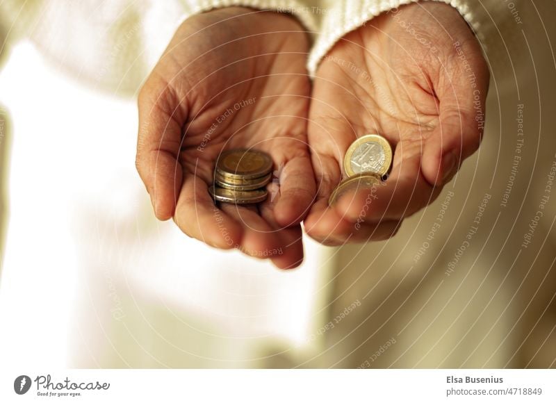 Coins in hands Money Euro Loose change Save finance Paying Luxury Income Economy investment Shopping Business Hand assets Success Rich savings Close-up payment