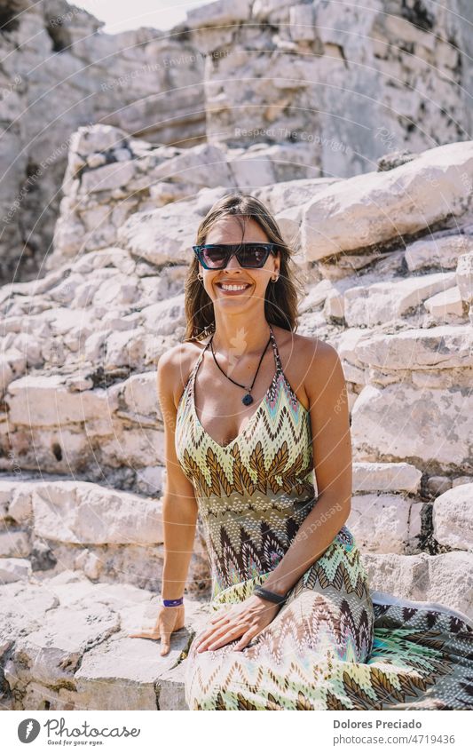 Woman sitting on some stone Mayan ruins accessory architecture attractive background beautiful beauty caucasian city desert destination dress elegance fashion