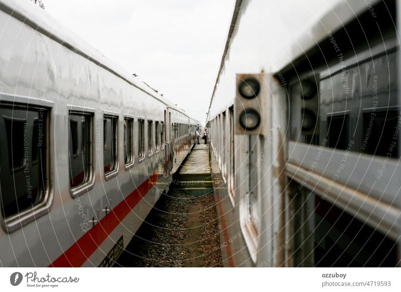 Passanger train stopped at station in Java Island Indonesia waiting to depart arriving asia background backpack carriage commuter commuting delivery departure