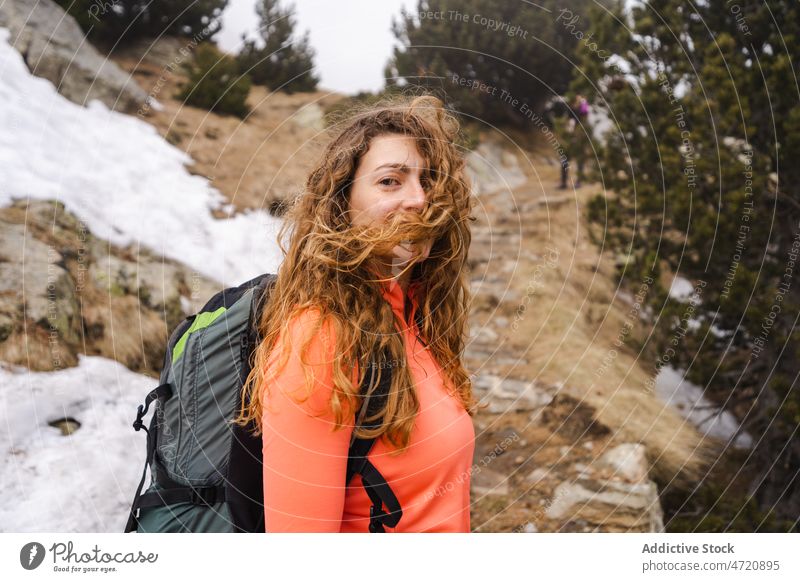 Cheerful woman hiking in nature traveler hiker trekking adventure journey explore pastime leisure trip activity wanderlust explorer tourist active vacation