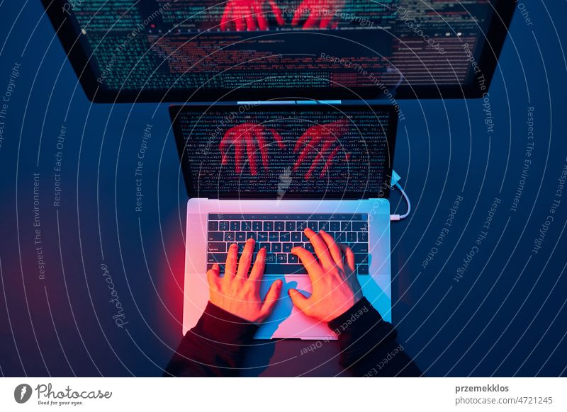 Man using computer and programming  to break code. Cyber security threat. Internet and network security. Stealing private information. Person using technology to steal password and private data