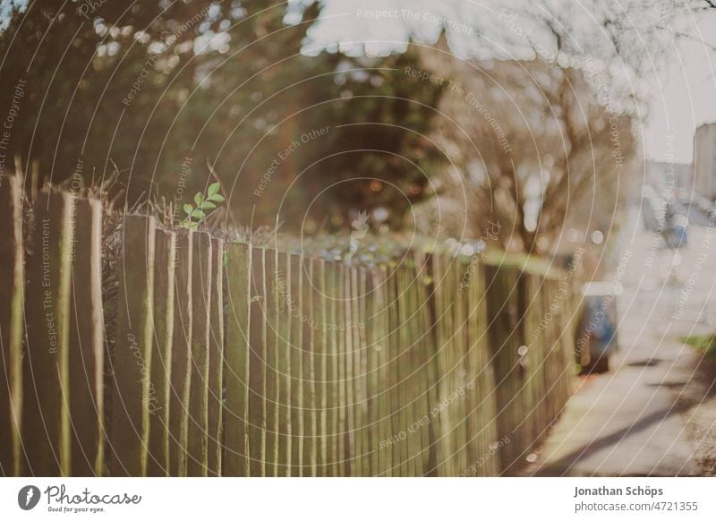 old picket fence in sunlight lattice fence Fence Wooden fence Sunlight Light Analog Retro movie vintage Garden Real estate Boundary line Footpath Sidewalk