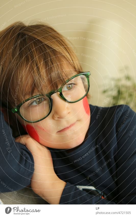 child wearing glasses looking away curious Emotions Mysterious Identity Uniqueness Smiling face laughing child fortunate joyfully Freedom Happy