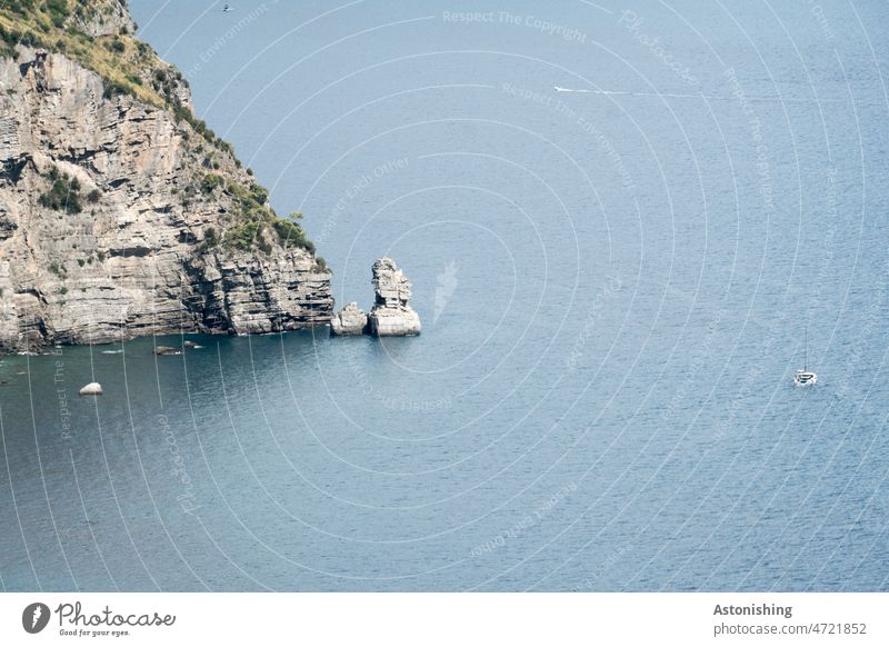 coastline Rock Island Stone Water Ocean Italy Campania WaterBoat stones plants Steep steep coast Waves Nature Landscape Light Shadow Grass lines Exterior shot