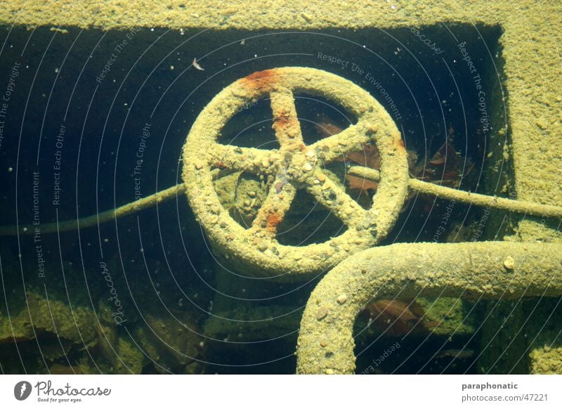 underwater wheel Wheel Crank Round Revolving Old Supply pipe Diversion Pebble Multicoloured Dirty Broken Exterior shot Second-hand Underwater photo in the water