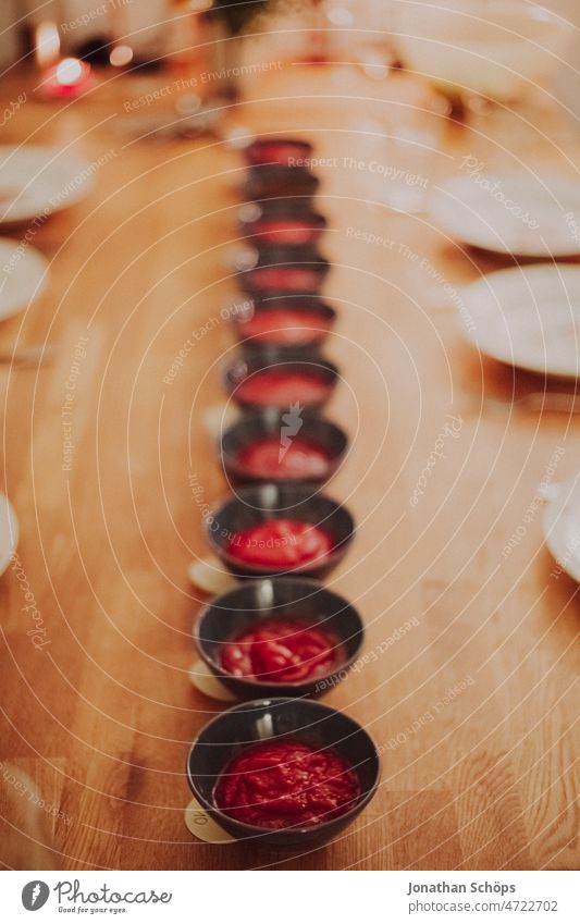 Bowls with ketchup on set table during ketchup tasting Ketchuptasting Birthday Birthday celebration To have a coffee Joy Table Feasts & Celebrations