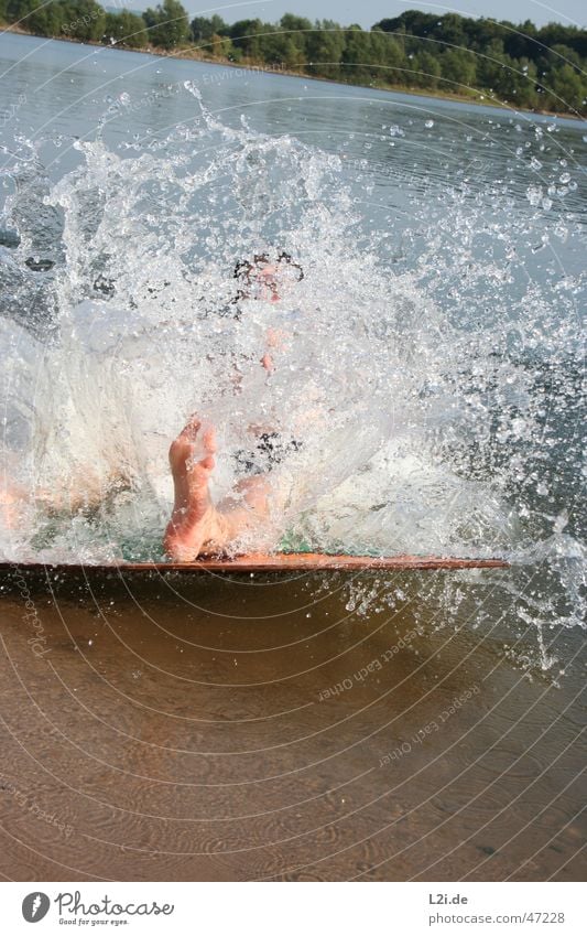 big splash Beach Tree Summer Action Sudden fall Waves Lake Water Drops of water Sand Sun Feet Human being Joy skiboard Movement Nature Wooden board