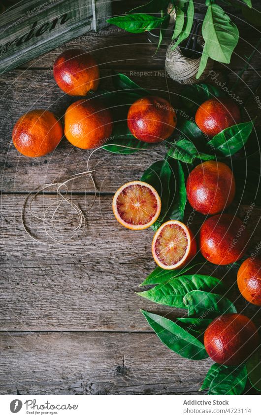 Bunch of blood oranges on table citrus fruit vitamin kitchen flavor organic box natural ripe fresh healthy wooden tasty delicious appetizing yummy heap home