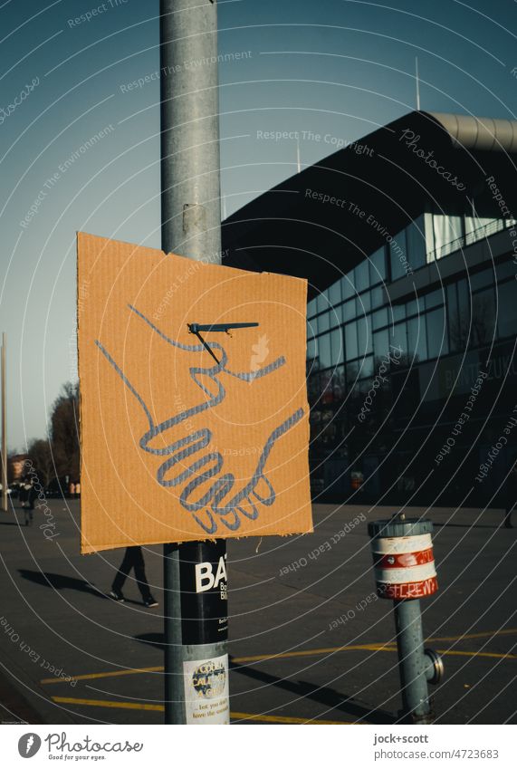 symbolic hands hanging in public space Hand Symbols and metaphors Gesture Street art Prenzlauer Berg Berlin Creativity sympathy Earmarked paperboard