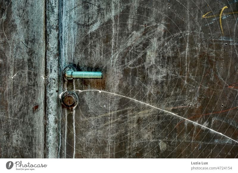 An old green iron door full of scratches, locked Lock Patina Green Scratch mark Old haggard Closed Entrance Door handle Safety Metal Door lock Detail Goal