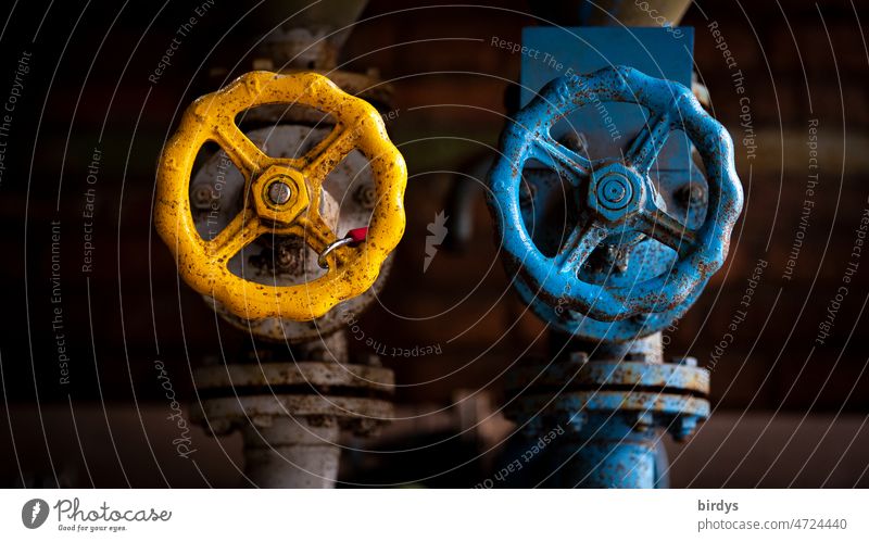 Stopcocks , gate valves for gas or oil pipelines in the national colors of Ukraine blue - yellow Ukraine war Trade embargo Gas Cooking oil Gas supply