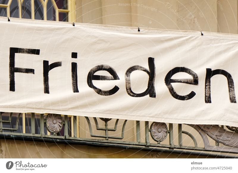 Banner with the inscription - Peace - on a balcony lattice banner Ukraine war Russia Desire for peace world peace Hope demand invitation Politics and state