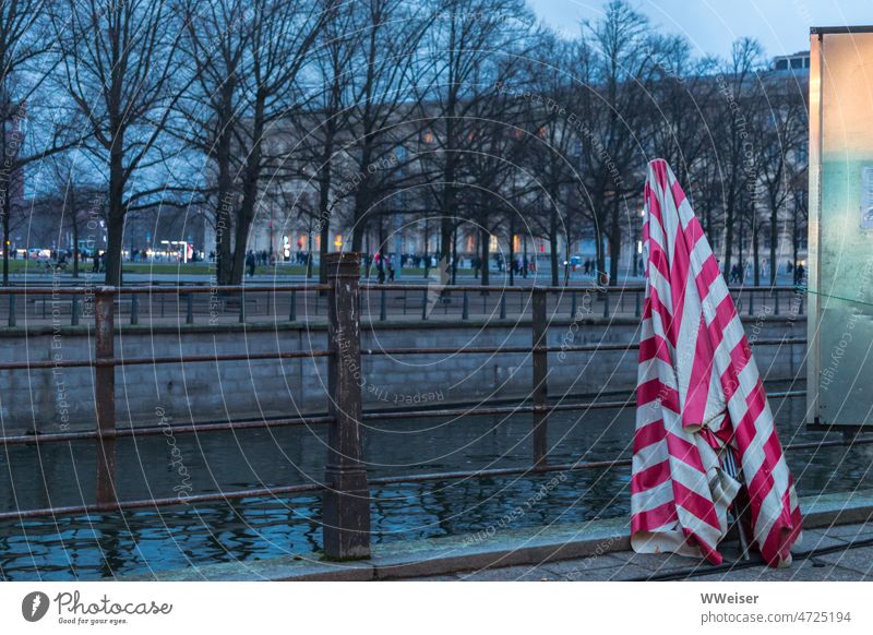 Blue hour at Kupfergraben in Berlin-Mitte with closed umbrella Evening Winter blue hour Copper Trench witness house Pleasure garden Middle Unter den Linden