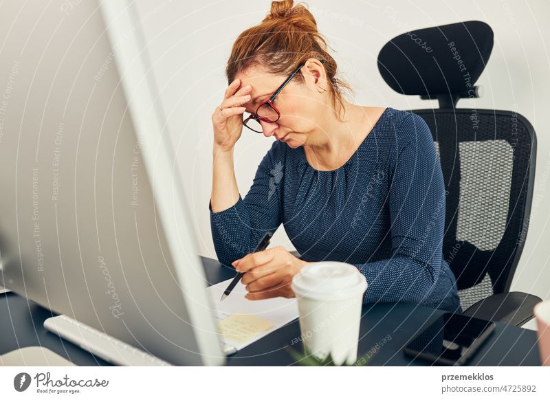 Woman entrepreneur focused on solving difficult work. Confused businesswoman thinking hard looking at computer screen frustration problem deadline