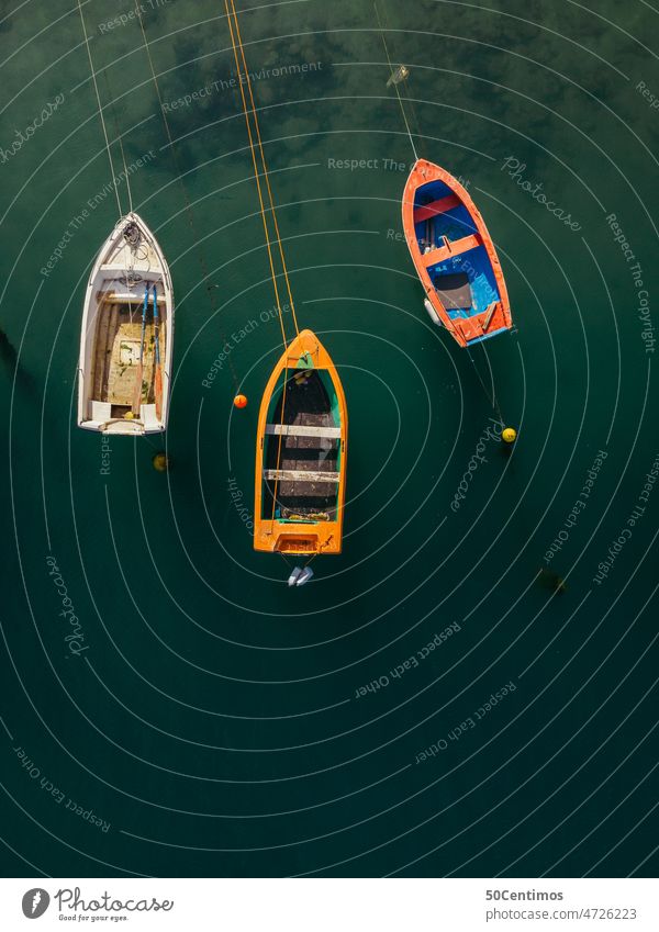 Three colorful racked boats - aerial view Sea water Green Watercraft Navigation coast Boating trip Rowboat UAV view Aerial photograph Downward Fishing boat