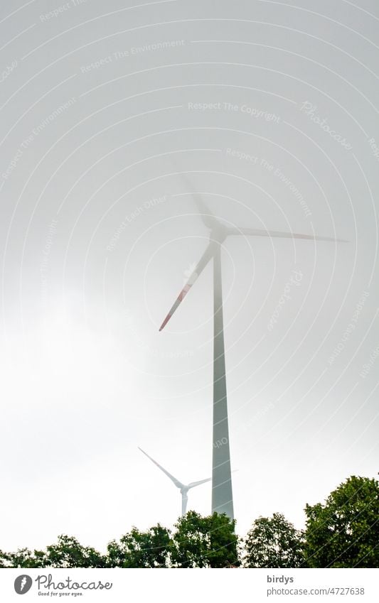 Wind turbine, wind turbine in the fog. Pinwheel Wind energy plant Fog foggy Renewable energy Energy industry Ukraine war Climate change wind power