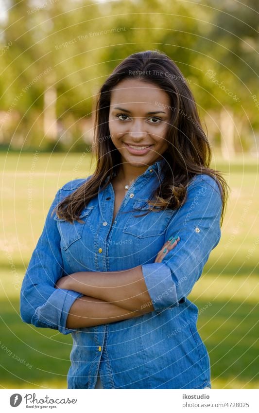 Beautiful African American woman beautiful happy african park grass portrait outdoor hair forest relax young american relaxing standing smile spring nature