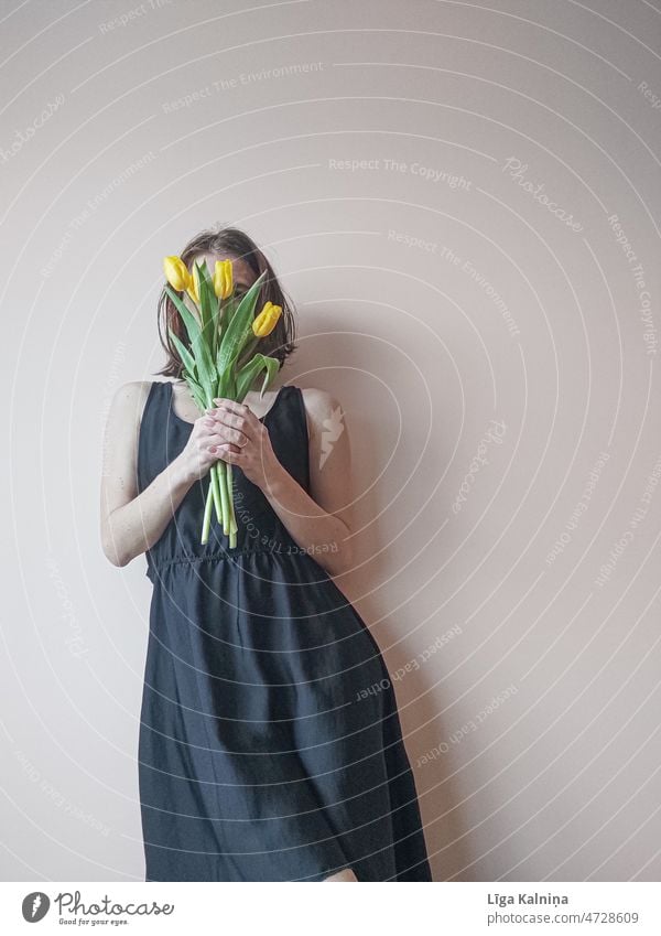 Women holding a bouquet of yellow tulips Tulips Bouquet Spring flowers Blossom Flower Decoration Interior shot Blossoming Tulip blossom Yellow bouquet of tulips