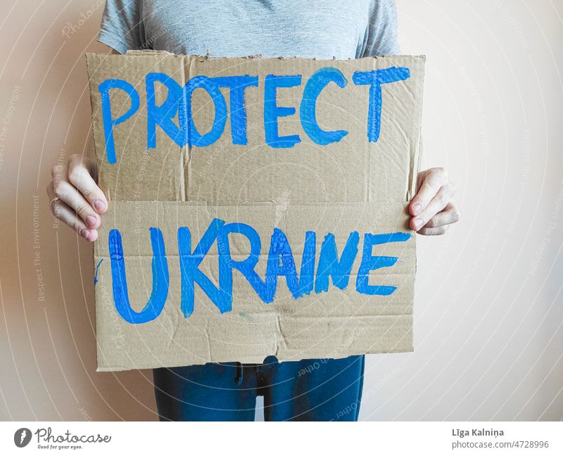 Protect Ukraine written on cardboard sign Protest protest Demonstration Politics and state Solidarity Society Responsibility Human rights Humanity Fairness