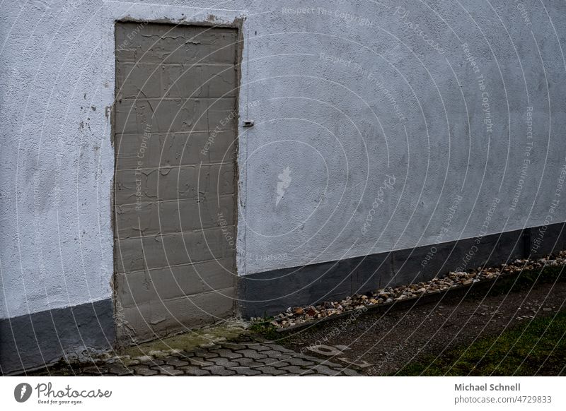 Bricked up entrance with clamp bricked up Bricked opening door Entrance obstructed Closed House (Residential Structure) Front door Facade locked inaccessible