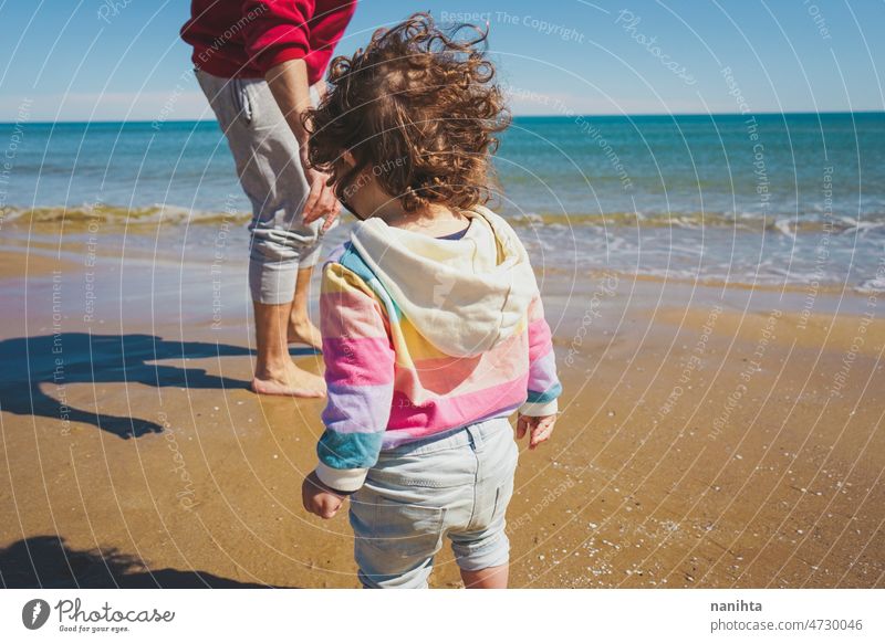 Young single dad take his little daughter to discover the sea family love baby girl beach holidays explore travel rainbow respectful childrearing harmony join