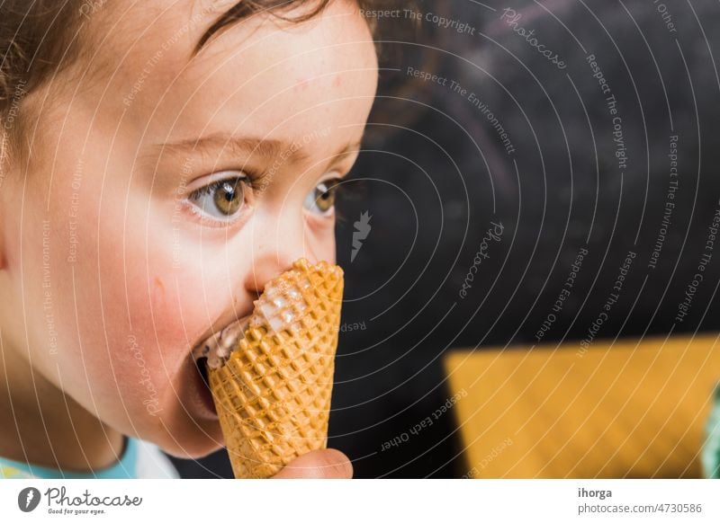 A baby eating ice cream background beautiful boy caucasian child closeup cute dessert face family food fun funny happy healthy hug ice-cream joy kid kids