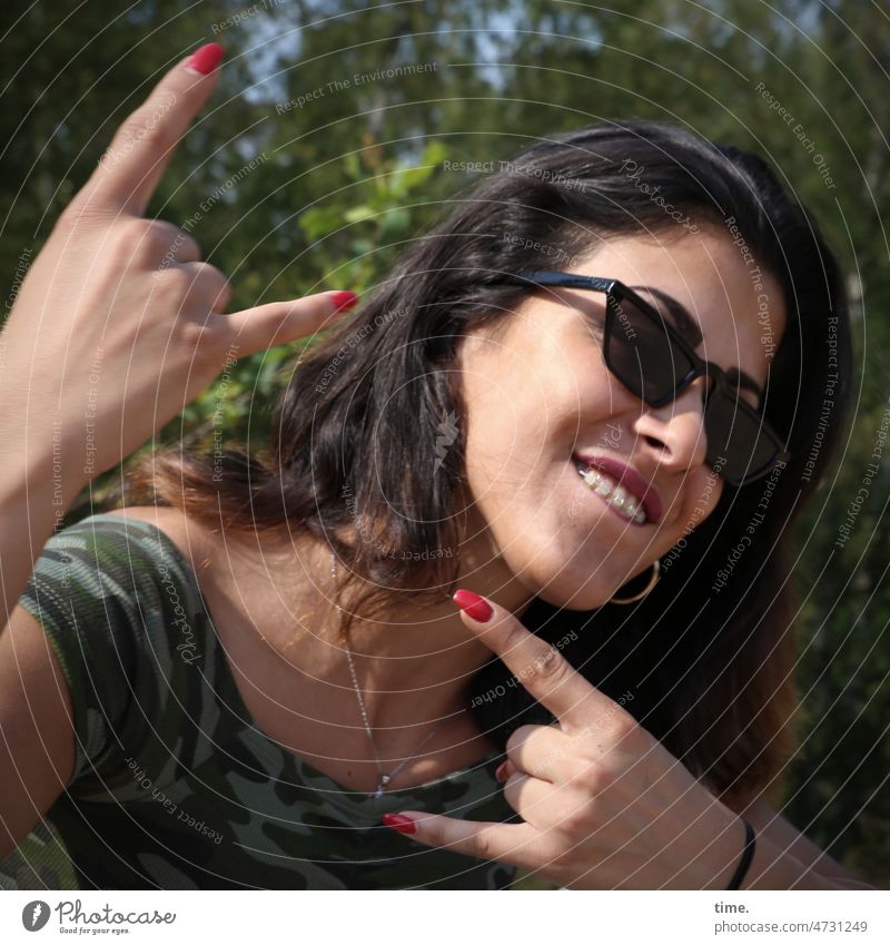 Woman with French Fry Fork (Wacken Style) Sunglasses Show of hands T-shirt Long-haired Feminine Dark-haired Nature sunny trees Braces Necklace