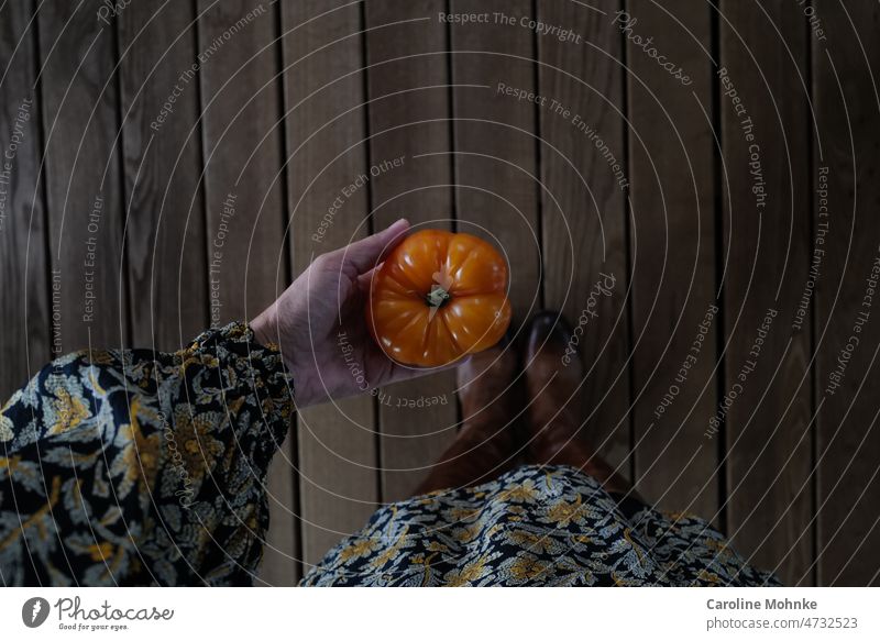 Woman holding a tomato in her hand tomatoes Food inflation Vegetable Fresh Healthy Tomato Red Nutrition Vegetarian diet Organic produce Delicious Colour photo