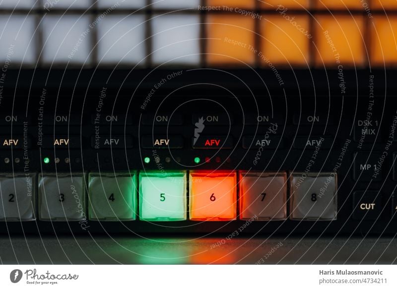 broadcasting equipment close up, video mixing machine background black business button closeup communication computer control data design device digital