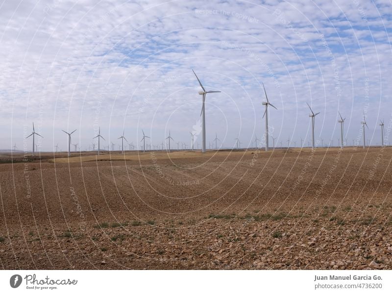 Wind farm in dry farmland. Alternative energy to the fossil fuel crisis alternative wind electricity insufficiency renewable green generator desert windmill