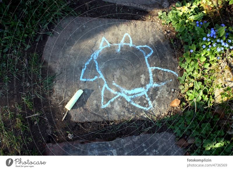 Drawing of a sun or flower painted with chalk on a stone slab Sun Flower Chalk crayon Painted Painting (action, artwork) Creativity street chalk Street painting