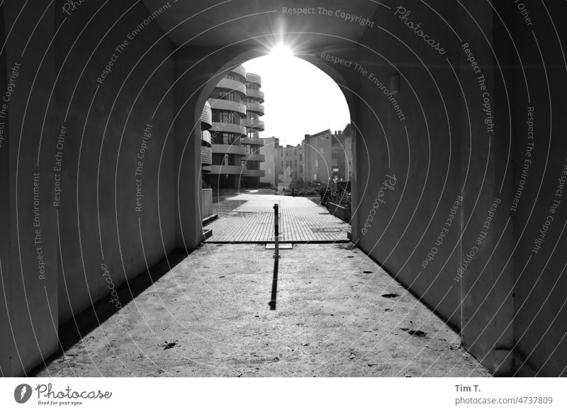 View through an old gateway to a new residential building Berlin Middle doorway Downtown Berlin Capital city Town Architecture Exterior shot Deserted Germany