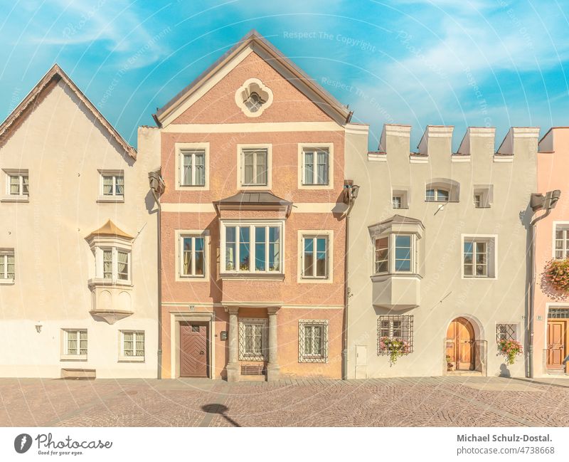 Historic town house in Bruneck in pastel colors South Tyrol mountains Alps Clouds alpine panorama Dramatic Idyll idyllically Moody hike hill clouds dramatic