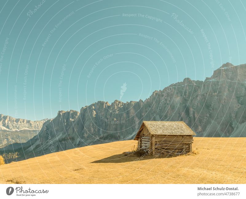 Alpine hut in high mountains in pastel colors South Tyrol Alps Clouds alpine panorama Dramatic Idyll idyllically Moody hike hill clouds dramatic mood sky Hut