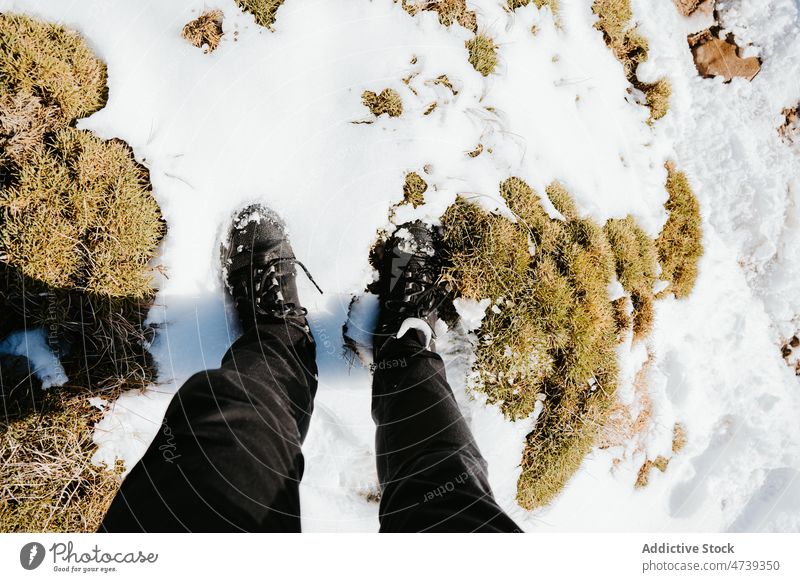 Unrecognizable traveler on snowy slope hiker nature winter hoarfrost adventure journey mountain frozen pena oroel spain jaca huesca cold season leg environment