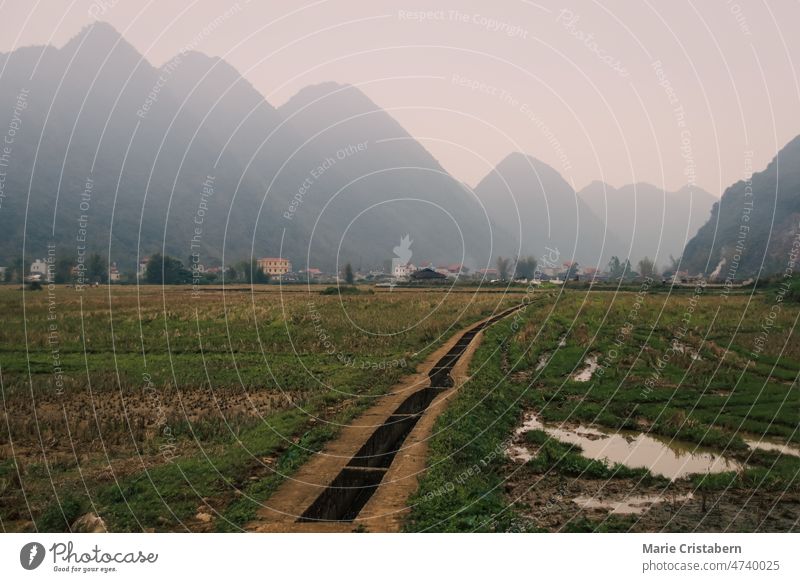 Cinematic scenery of fogs covering the karst mountains in rural Bac Son in Vietnam bac son vietnam lang son foggy landscape asia travel destination cinematic