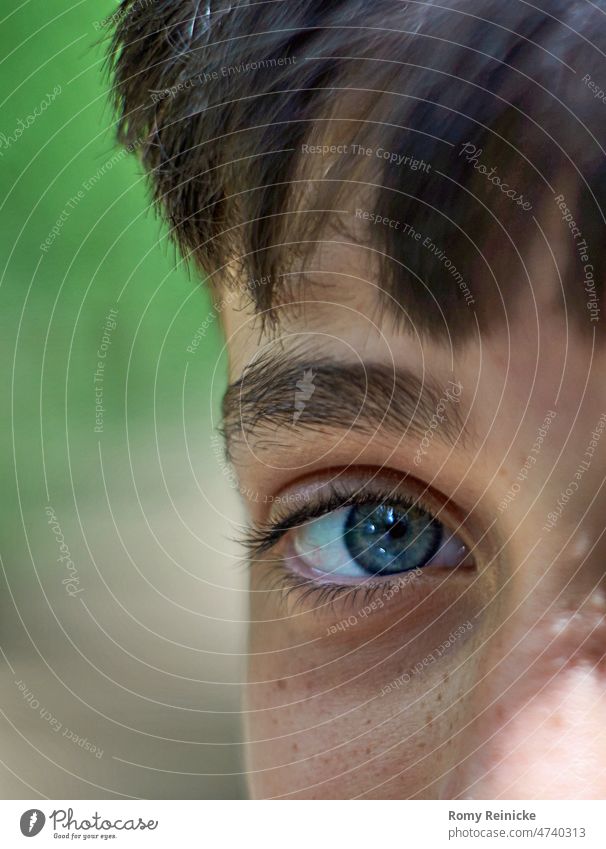 Eye contact, partial portrait with bright blue eye Close-up blue eyes Eyes Human being Children's eyes Pupil Eyelash Looking view in camera Boy (child)