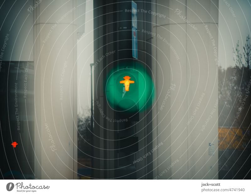 Traffic light for pedestrians is red but lights green Pedestrian traffic light Pictogram ampelmännchen Technology Mobility Illuminate Road sign Signal Green Red